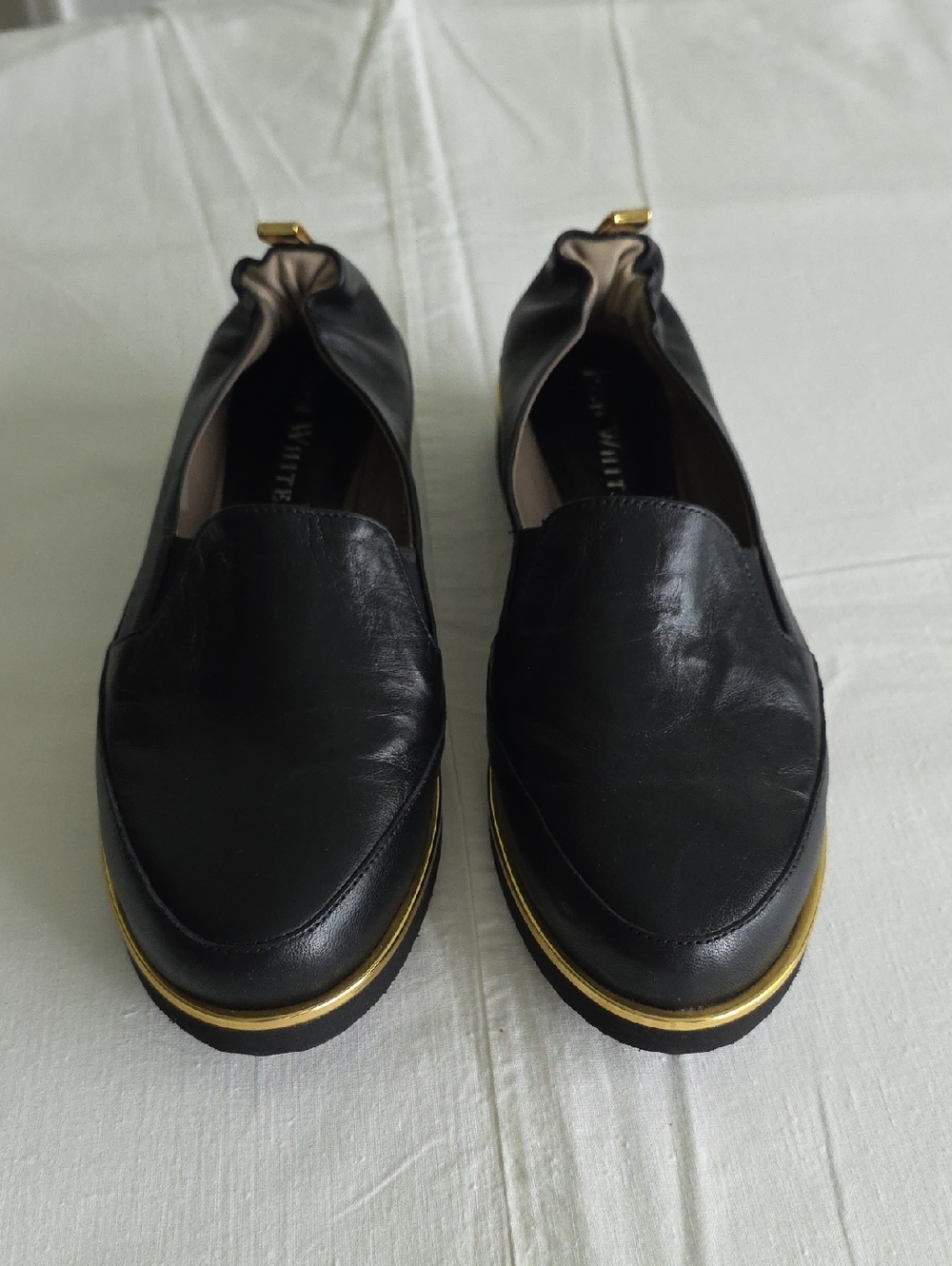 Black Leather Slip-On Loafers with Gold Trim